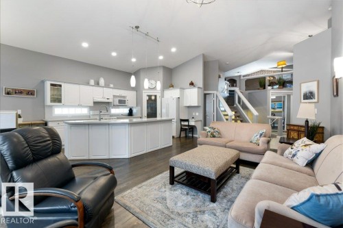 Living room featuring dark wood-style flooring and vaulted ceiling - 8 Osborne Close, St. Albert, AB - Indoor Photo Showing Living Room