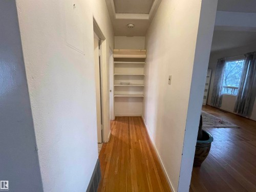 Hallway featuring light wood-style flooring and baseboards - 11250 72 Avenue, Edmonton, AB - Indoor Photo Showing Other Room