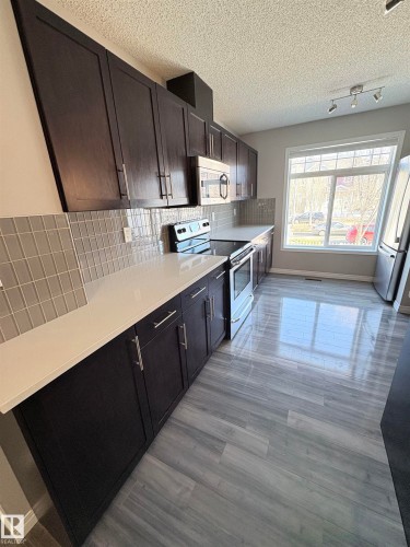Edmonton, AB - Indoor Photo Showing Kitchen
