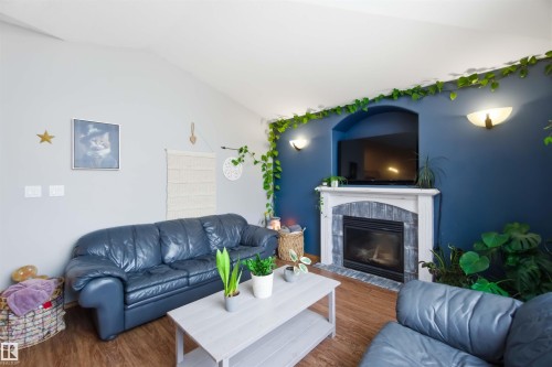 1304 Oakland Crescent, Devon, AB - Indoor Photo Showing Living Room With Fireplace