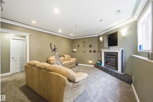 1304 Oakland Crescent, Devon, AB - Indoor Photo Showing Other Room With Fireplace