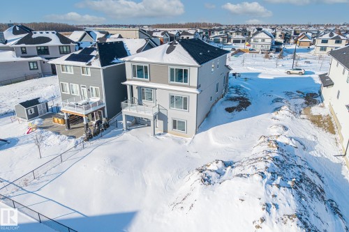 This property features a multi-level exterior with a balcony and a lower patio area - 132 Edgewater Circle, Leduc, AB - Outdoor
