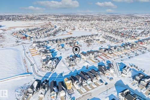 Aerial view of the community, showcasing its extensive residential development and proximity to a body of water - 132 Edgewater Circle, Leduc, AB - Outdoor With View