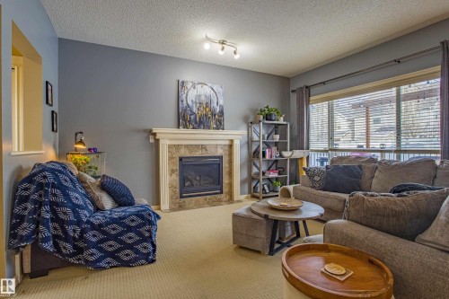 3031 Spence Wynd, Edmonton, AB - Indoor Photo Showing Living Room With Fireplace