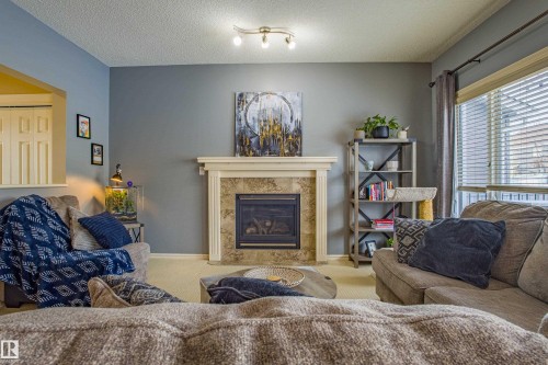 3031 Spence Wynd, Edmonton, AB - Indoor Photo Showing Living Room With Fireplace