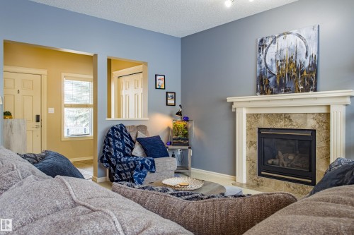 3031 Spence Wynd, Edmonton, AB - Indoor Photo Showing Living Room With Fireplace