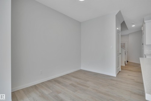 Empty room featuring light wood-style flooring and recessed lighting - 2275 Alces Drive, Edmonton, AB - Indoor Photo Showing Other Room