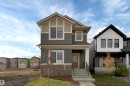 Craftsman inspired home with a front yard and stone siding - 2275 Alces Drive, Edmonton, AB  - Outdoor With Facade 