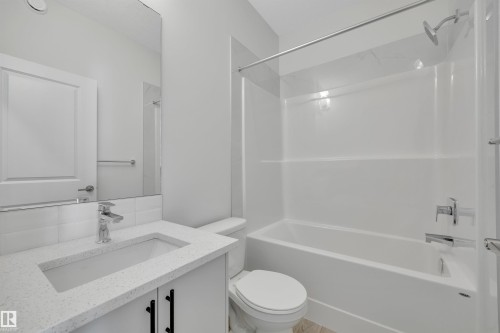 Bathroom with bathing tub / shower combination and vanity - 2275 Alces Drive, Edmonton, AB - Indoor Photo Showing Bathroom