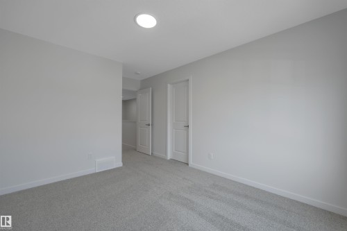 Empty room featuring carpet flooring and baseboards - 2275 Alces Drive, Edmonton, AB - Indoor Photo Showing Other Room