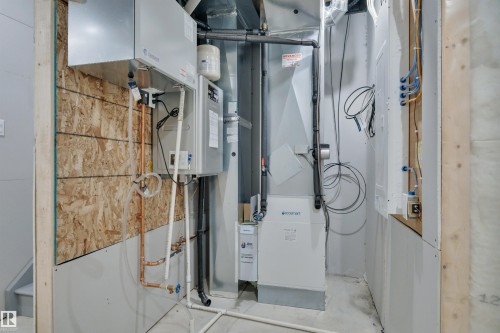 Utilities featuring heating unit and water heater - 2275 Alces Drive, Edmonton, AB - Indoor Photo Showing Other Room