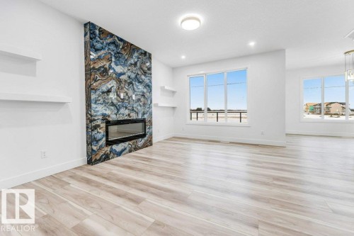 219 Crystal Creek Drive, Leduc, AB - Indoor Photo Showing Living Room With Fireplace