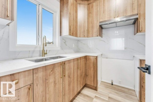 219 Crystal Creek Drive, Leduc, AB - Indoor Photo Showing Kitchen With Double Sink