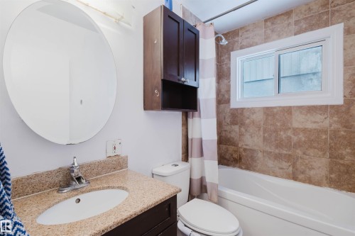 Bathroom featuring vanity and shower / tub combo - 6048 105B Street Nw, Edmonton, AB - Indoor Photo Showing Bathroom