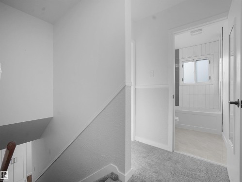 Staircase with baseboards and carpet floors - 10329 132 Avenue, Edmonton, AB - Indoor Photo Showing Other Room