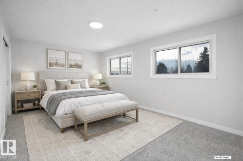 Carpeted bedroom featuring baseboards - 10329 132 Avenue, Edmonton, AB - Indoor Photo Showing Bedroom