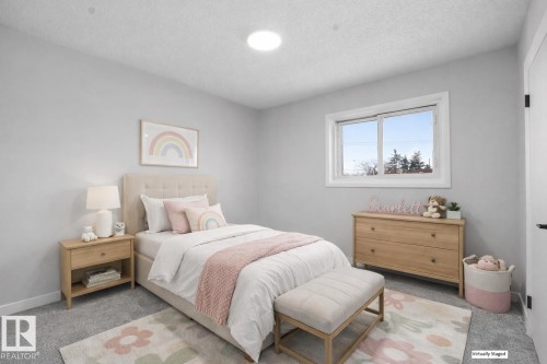 Bedroom with carpet flooring and a textured ceiling - 10329 132 Avenue, Edmonton, AB - Indoor Photo Showing Bedroom