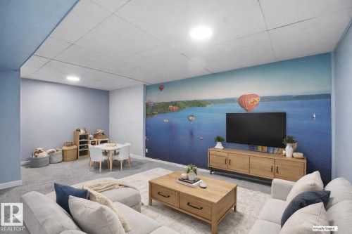 Living room featuring carpet floors and baseboards - 10329 132 Avenue, Edmonton, AB - Indoor