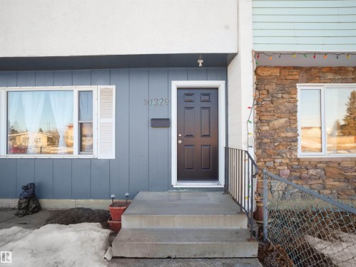 Doorway to property with stone siding - 10329 132 Avenue, Edmonton, AB - Outdoor With Exterior