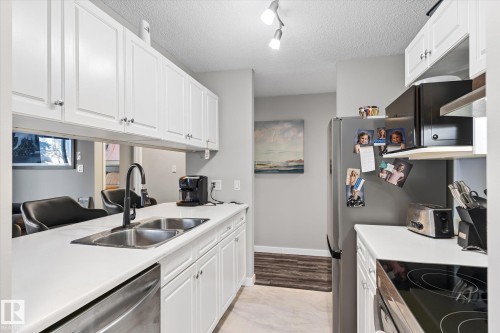 141 17447 98A Avenue, Edmonton, AB - Indoor Photo Showing Kitchen With Double Sink
