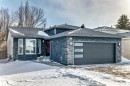 View of front of home with stone siding, a shingled roof, and a garage - 7011 190B Street, Edmonton, AB  - Outdoor 