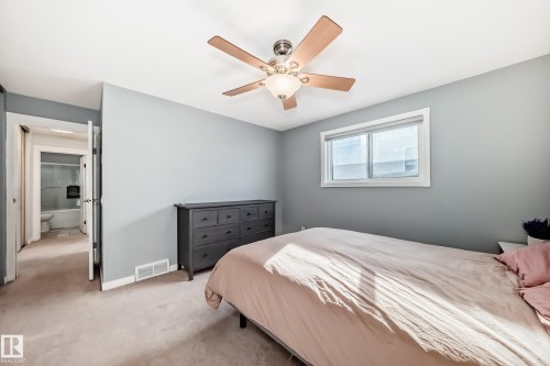 Bedroom with carpet and ceiling fan - 7011 190B Street, Edmonton, AB - Indoor Photo Showing Bedroom
