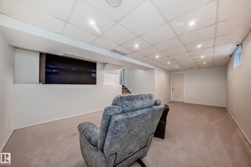 Sitting room with light colored carpet, a paneled ceiling, and recessed lighting - 7011 190B Street, Edmonton, AB - Indoor