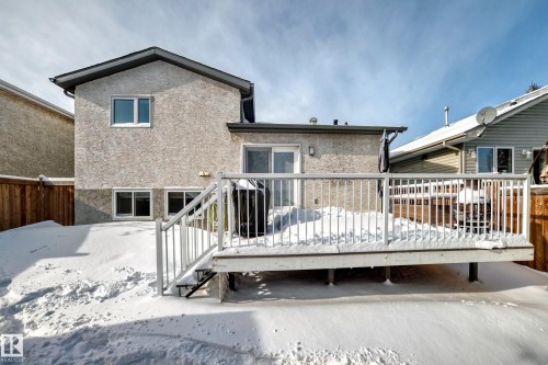 Rear view of property with a deck and stucco siding - 7011 190B Street, Edmonton, AB - Outdoor With Deck Patio Veranda With Exterior