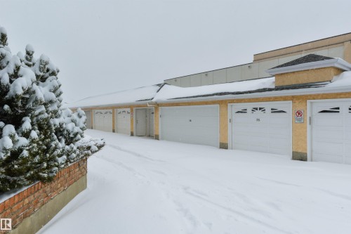 View of snow covered garage - 232 15499 Castle Downs Road, Edmonton, AB - Outdoor