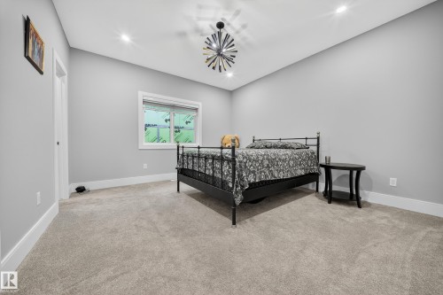 Bedroom with light carpet and recessed lighting - 4406 Triomphe Close, Beaumont, AB - Indoor Photo Showing Bedroom