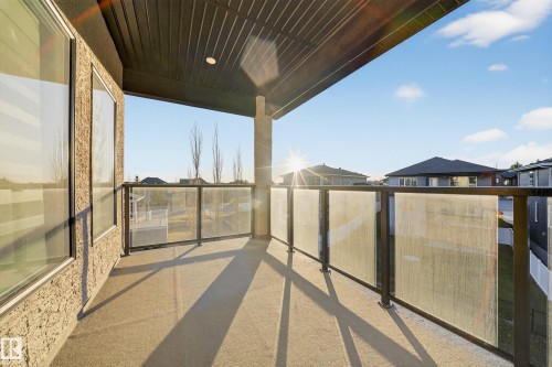 Balcony featuring a residential view - 4406 Triomphe Close, Beaumont, AB - Outdoor With Exterior
