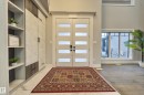 Foyer entrance featuring french doors and baseboards - 4406 Triomphe Close, Beaumont, AB  - Indoor Photo Showing Other Room 