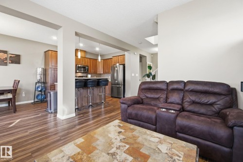 Living room with dark wood finished floors and baseboards - 3087 Arthurs Crescent, Edmonton, AB - Indoor Photo Showing Living Room
