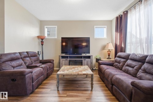 Living room featuring wood finished floors and plenty of natural light - 3087 Arthurs Crescent, Edmonton, AB - Indoor Photo Showing Living Room