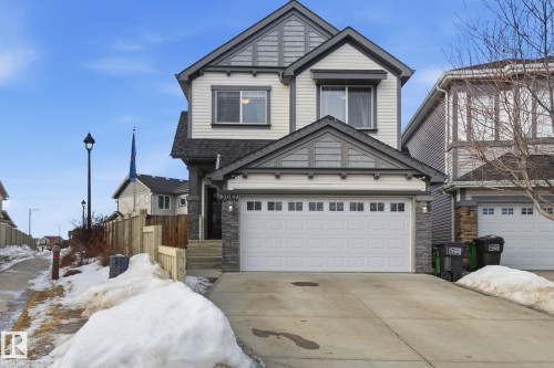 Craftsman inspired home with stone siding, a garage, concrete driveway, and a shingled roof - 3087 Arthurs Crescent, Edmonton, AB - Outdoor With Facade