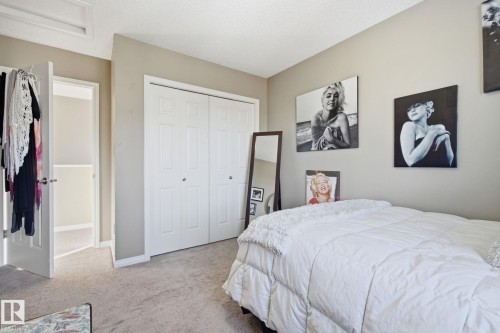 Bedroom with carpet floors and a closet - 3087 Arthurs Crescent, Edmonton, AB - Indoor Photo Showing Bedroom