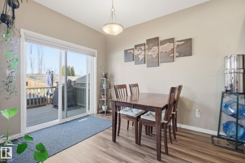 Dining room with wood finished floors and baseboards - 3087 Arthurs Crescent, Edmonton, AB - Indoor Photo Showing Dining Room