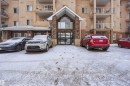 Snow covered building featuring a view of apartment building / complex and uncovered parking - 407 2305 35A Avenue, Edmonton, AB  - Outdoor 