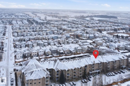 Snowy aerial view with a residential view - 407 2305 35A Avenue, Edmonton, AB - Outdoor With View