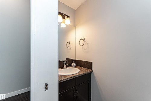 Bathroom featuring vanity and wood finished floors - 6963 19A Avenue, Edmonton, AB - Indoor Photo Showing Bathroom