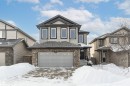View of front of home featuring stone siding and a garage - 6963 19A Avenue, Edmonton, AB  - Outdoor With Facade 