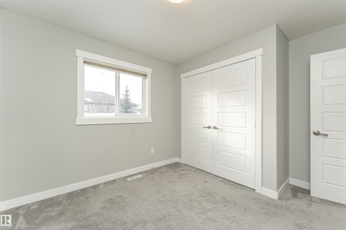 Unfurnished bedroom featuring carpet floors and a closet - 6963 19A Avenue, Edmonton, AB - Indoor Photo Showing Other Room