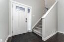 Foyer with baseboards and dark wood finished floors - 6963 19A Avenue, Edmonton, AB  - Indoor Photo Showing Other Room 