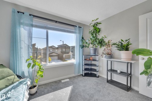Interior space featuring carpet floors and baseboards - 157 Larch Crescent, Leduc, AB - Indoor Photo Showing Other Room