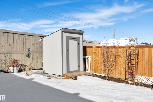 View of shed featuring a fenced backyard - 157 Larch Crescent, Leduc, AB - Outdoor