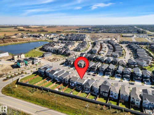 View of property location with nearby suburban area and a nearby body of water - 157 Larch Crescent, Leduc, AB - Outdoor With View
