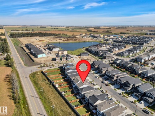 Aerial view of property's location with nearby suburban area and rural landscape - 157 Larch Crescent, Leduc, AB - Outdoor With View