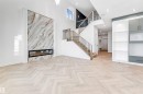 Unfurnished living room with a fireplace, a high ceiling, recessed lighting, stairway, and built in shelves - 21 Trill Point(E), Spruce Grove, AB  - Indoor With Fireplace 