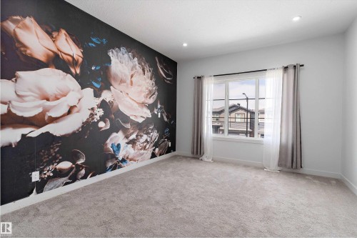 Empty room with an accent wall, carpet, and recessed lighting - 5747 Kootook Way, Edmonton, AB - Indoor Photo Showing Other Room