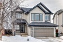 View of front facade with an attached garage, a shingled roof, and stone siding - 1908 69 Street, Edmonton, AB  - Outdoor 
